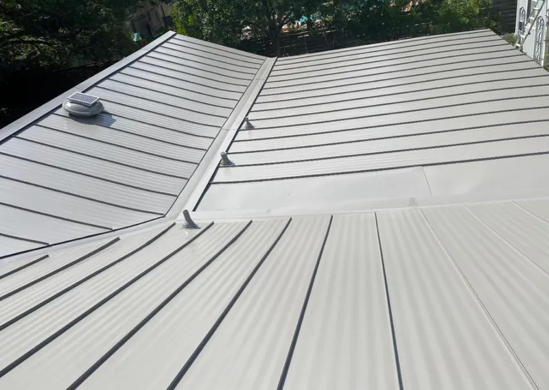 Solar attic fan installed on a metal roof for Roof Ventilation in Redwood Falls